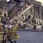Firefighters take a break at the site of the terrorist attack at the Pentagon, Sept. 11, 2001. The terrorists struck the World Trade Center Towers in New York City and the Pentagon.