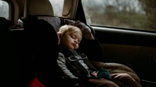 toddler asleep in carseat