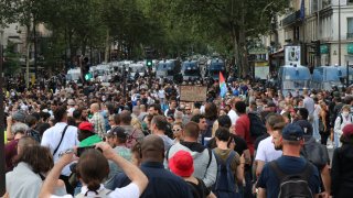 People demonstrate against new health laws likely to come into force from Aug. 9, in Paris on July 31, 2021.