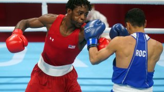 Keyshawn Davis of the USA and Gabil Mamedov of the ROC during the Men's Light (57-63kg) Quarterfinal 1 at the Kokugikan Arena.