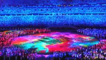 A light show runs in Olympic Stadium as part of the Tokyo Olympics Closing Ceremony, Aug. 8, 2021, Tokyo.