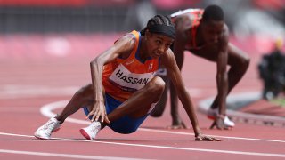 TOKYO, JAPAN - AUGUST 02: Sifan Hassan of Team Netherlands gets back up after falling over Edinah Jebitok of Team Kenya in round one of the Women's 1500m heats on day ten of the Tokyo 2020 Olympic Games at Olympic Stadium on August 02, 2021 in Tokyo, Japan.