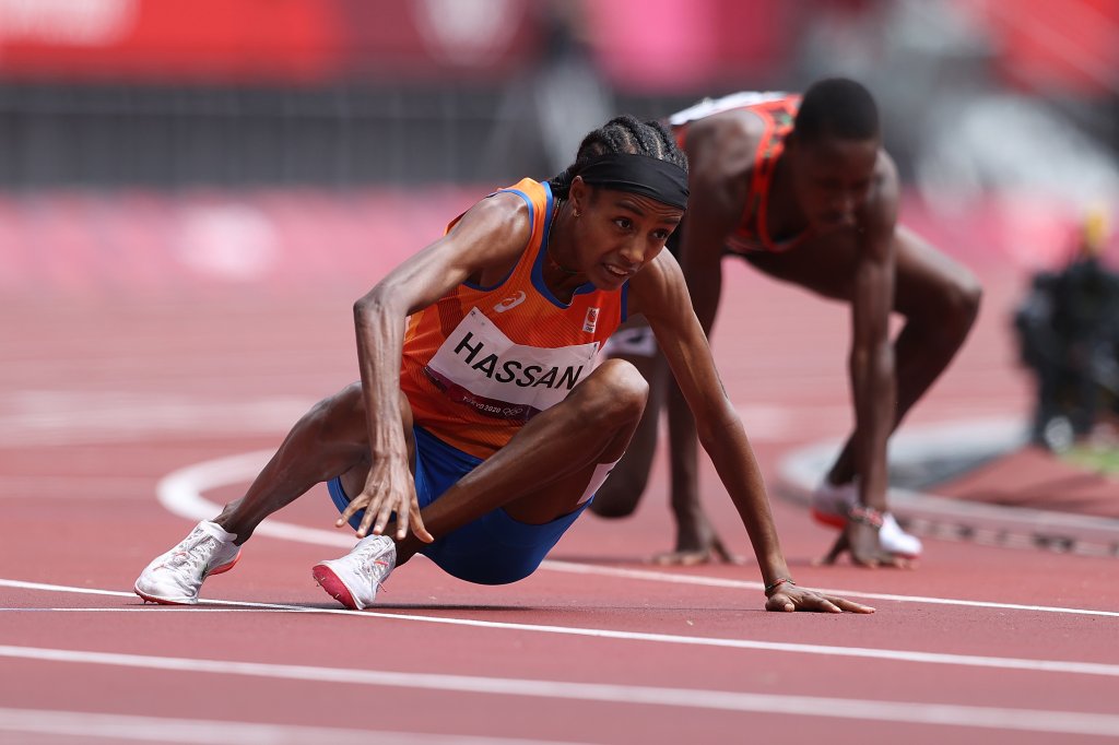 TOKYO, JAPAN - AUGUST 02: Sifan Hassan of Team Netherlands gets back up after falling over Edinah Jebitok of Team Kenya in round one of the Women's 1500m heats on day ten of the Tokyo 2020 Olympic Games at Olympic Stadium on August 02, 2021 in Tokyo, Japan.