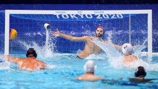 Konstantinos Genidounias of Team Greece scores a goal past Drew Holland of Team United States during the Men's Preliminary Round Group A match between Greece and the United States on day ten of the Tokyo 2020 Olympic Games at Tatsumi Water Polo Centre on Aug. 2, 2021, in Tokyo, Japan.