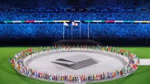 Athletes carry their nations' flags to the field of play during the closing ceremony of the Tokyo 2020 Olympic Games, on Aug. 8, 2021 at the Olympic Stadium in Tokyo.