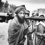 A mujahadeen fighter carries a U.S.-made shoulder-fired Stinger missile during the 1989 Jalalabad offensive in eastern Afghanistan. The weapon is capable of shooting down fast-moving aircraft by locking on to the heat signal generated by the engines.