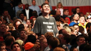 MINNEAPOLIS - SEPTEMBER 12: Rochester, Minnesota resident Igor Vovkovinskiy, 27, watches as President Barack Obama arrives to speak on health care during a rally at the Target Center on September 12, 2009 in Minneapolis, Minnesota. The President is trying to gain support for his health insurance reform plans.