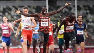 Kenya's Emmanuel Kipkurui Korir (C) reacts after winning next to second placed Kenya's Ferguson Cheruiyot Rotich after the men's 800m final during the Tokyo 2020 Olympic Games