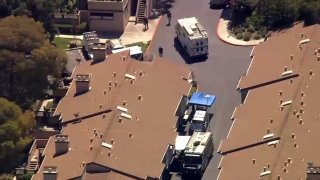 San Jose police work at the scene of a barricaded suspect.