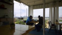 Workers at Mersea Restaurant eat lunch with a view of San Francisco.