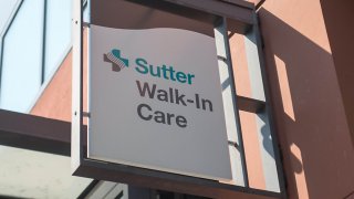 Close-up of sign for an urgent care center operated by the healthcare and hospital chain Sutter Health in the South of Market (SoMa) neighborhood of San Francisco, California, October 13, 2017. (Photo by Smith Collection/Gado/Getty Images)