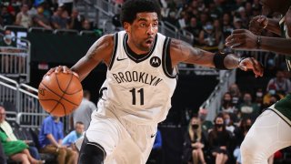 Kyrie Irving #11 of the Brooklyn Nets drives to the basket against the Milwaukee Bucks during Round 2, Game 3 of the 2021 NBA Playoffs on June 10, 2021 at the Fiserv Forum Center in Milwaukee, Wisconsin.