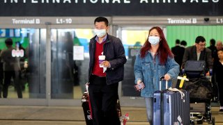 Passengers at LAX after arriving from Shanghai, China, after a positive case of the coronavirus was announced in the Orange County suburb of Los Angeles, January 26, 2020.