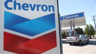 A sign is posted in front of a Chevron gas station on July 31, 2020 in Novato, California.