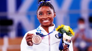 Bronze medallist Simone Biles of the United States celebrates on the podium, August 3, 2021.