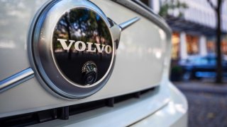 A Volvo badge and parking-assist camera on the grille of an automobile at a Volvo Cars AB dealership in Stockholm, Sweden, on Thursday, Aug. 19, 2021.