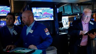 Traders work on the floor of the New York Stock Exchange in New York City on Oct. 20, 2021.