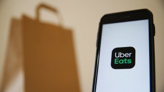 The Uber Eats logo displayed on a smartphone.