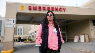 Angelique Ramirez, chief medical officer at Foundation Health Partners in Fairbanks, poses for a photograph in front of the emergency entrance at Fairbanks Memorial Hospital on Tuesday, Sept. 21, 2021, in Fairbanks, Alaska.