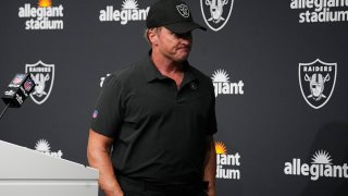 FILE - Las Vegas Raiders head coach Jon Gruden leaves after speaking during a news conference after an NFL football game against the Chicago Bears in Las Vegas, in this Sunday, Oct. 10, 2021, file photo. Jon Gruden is out as coach of the Las Vegas Raiders after emails he sent before being hired in 2018 contained racist, homophobic and misogynistic comments. Gruden released a statement Monday night, Oct. 11, 2021, that he is stepping down after The New York Times reported that Gruden frequently used misogynistic and homophobic language directed at Commissioner Roger Goodell and others in the NFL.