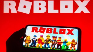 In this photo illustration the Roblox logo is displayed on a smartphone.