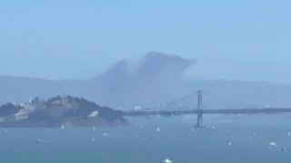 A fire in Oakland sent smoke up in the air that was visible from across the bay in San Francisco. (Oct. 10, 2021)