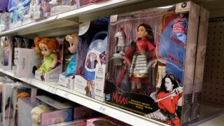 A doll based on the upcoming Walt Disney Studios film "Mulan" is displayed in the toy section of a Target department store, April 30, 2020, in Glendale, Calif.