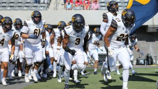 University of California Golden Bears enter the field.