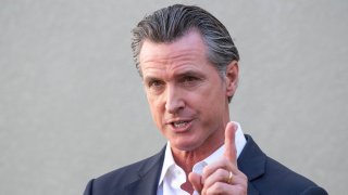 Gov. Gavin Newsom takes questions during a press conference.