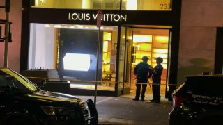 Police at the Louis Vuitton store in San Francisco following a retail robbery.