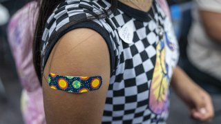 A child wears a band-aid after receiving a dose of the Pfizer-BioNTech Covid-19 vaccine at a vaccination clinic at an elementary school in San Jose, California, U.S., on Thursday, Nov. 4, 2021. Photographer: David Paul Morris/Bloomberg