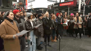 Broadway stars sing "Sunday" by Stephen Sondheim in Times Square.