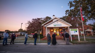 Voters line up to cast their ballots on Election Day, Tuesday, Nov. 3, 2020, in Emerson, Ga.