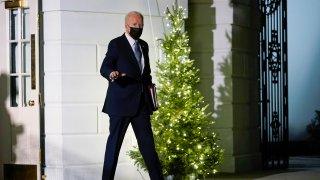 President Joe Biden waves as he walks to Marine One on the South Lawn of the White House in Washington, Friday, Dec. 3, 2021, as he prepares to leave for Camp David.