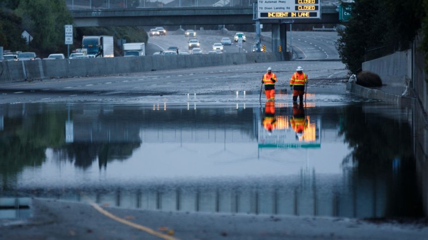 NEWARK, CALIFORNIA – October 25: Caltrans crews work to clear the storm drains from debris at a flooded section of the Southbound Interstate 880 between Thornton Avenue and Mowry Avenue on Oct. 25, 2021, in Newark, Calif. An atmospheric river storm, the strongest to hit the Bay Area in two years moved through the Bay Area on Sunday. (Photo by Dai Sugano/MediaNews Group/The Mercury News via Getty Images)