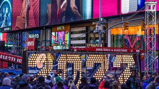 FILE - The 2022 sign that will be lit on top of a building on New Year's Eve is displayed in Times Square, New York, Dec. 20, 2021.
