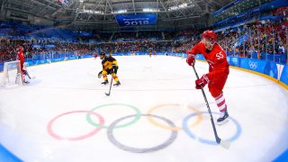 Olympic Athlete from Russia defenseman Bogdan Kiselevich (55) moves the puck against Germany in the men's ice hockey gold medal match during the Pyeongchang 2018 Olympic Winter Games. (Credit: USA TODAY Sports)