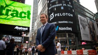 John Foley, co-founder and chief executive officer of Peloton Interactive Inc., stands for a photograph during the company’s initial public offering (IPO) in front of the Nasdaq MarketSite in New York, U.S., on Thursday, Sept. 26, 2019.