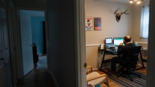 Ethan Miller works on his taxes at home in Silver Spring, Md.