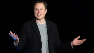 Elon Musk gestures as he speaks during a press conference at SpaceX’s Starbase facility near Boca Chica Village in South Texas on February 10, 2022.