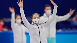 Gold medalists, of the Russian Olympic Committee, arrive for the victory ceremony after the team event in the figure skating competition at the 2022 Winter Olympics, Monday, Feb. 7, 2022, in Beijing.