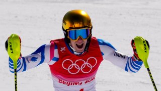 Clement Noel, of France, celebrates after finishing the men's slalom run 2 at the 2022 Winter Olympics, Wednesday, Feb. 16, 2022, in the Yanqing district of Beijing.