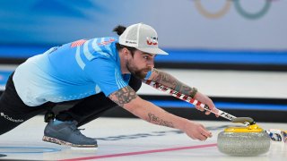 Team USA's Christopher Plys competes in mixed double curling against Australia, at the National Aquatics Centre for the 2022 Winter Olympic Games in Beijing, Feb. 2, 2022.
