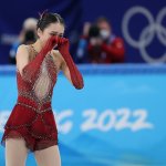 Zhu Yi of China reacts after the figure skating team event