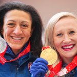 Kaillie Humphries (right) of the USA celebrates her gold medal with silver medalist Elana Meyers Taylor after the Women's Monobob event at the National Sliding Centre on Feb. 14, 2022, in Yanqing, China.