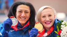 Kaillie Humphries (right) of the USA celebrates her gold medal with silver medalist Elana Meyers Taylor after the Women's Monobob event at the National Sliding Centre on Feb. 14, 2022, in Yanqing, China.