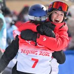 China's Eileen Gu (R) hugs winner Switzerland's Mathilde Gremaud after the Freestyle Skiing Women's Freeski Slopestyle final run during the 2022 Winter Olympics at the Genting Snow Park H & S Stadium in Zhangjiakou, China on Feb. 15, 2022.