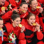Gold medallist Canada team players celebrates gold at the victory ceremony for the gold medal Women's Ice Hockey match between Canada and the United States at the 2022 Winter Olympic Games, Feb. 17, 2022, in Beijing.