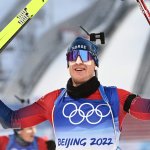 Norway's Johannes Thingnes Boe celebrates winning Gold in the Biathlon Men's 15km Mass Start event, Feb. 18, 2022, at the 2022 Winter Olympic Games.