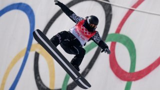 Shaun White of Team United States performs a trick on a practice run